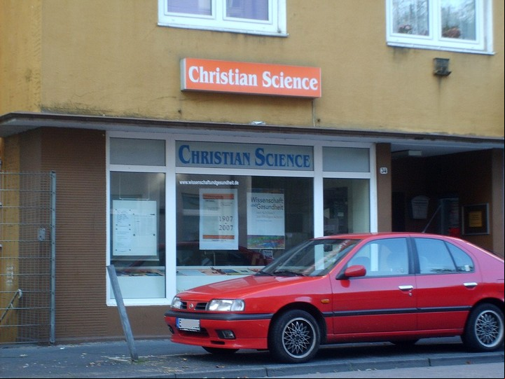 Un local con el cartel "Ciencia Cristiana".